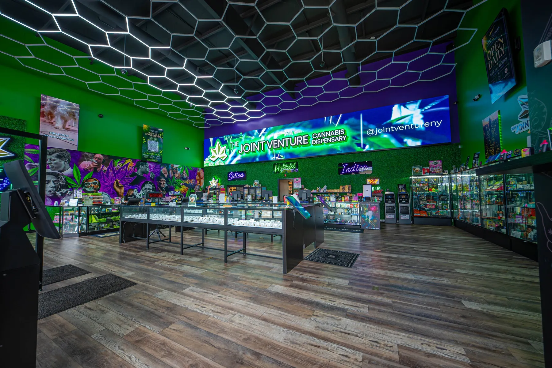 The showroom floor, its display cases and The Joint Venture screen on the back wall.